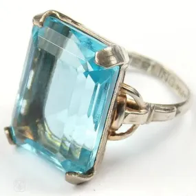 A ring that features a large emerald cut faux aquamarine set in sterling. c.1930